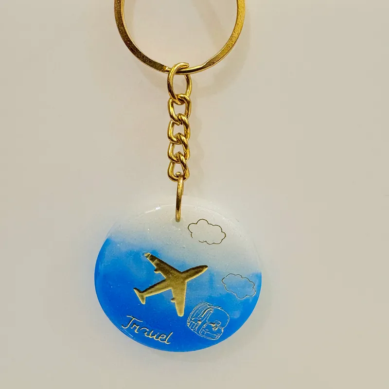 Wanderlust Skies Airplane & Backpack Resin Keychain